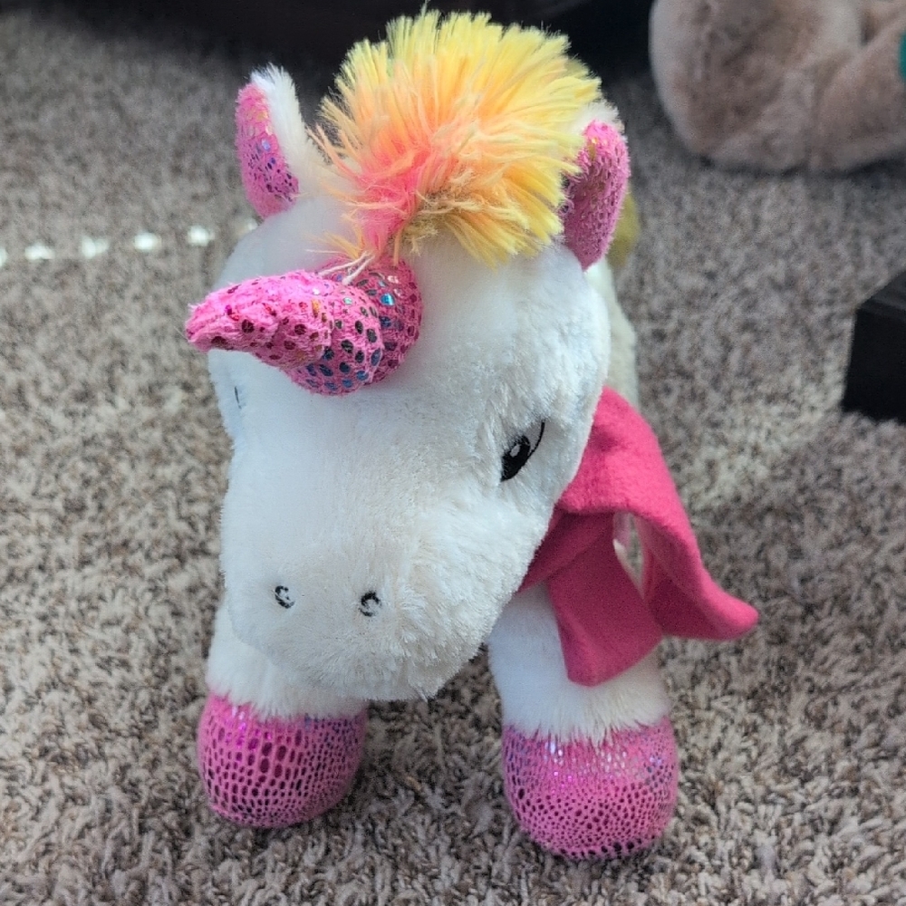 Plush Unicorn Toy with Pink and Yellow Accents